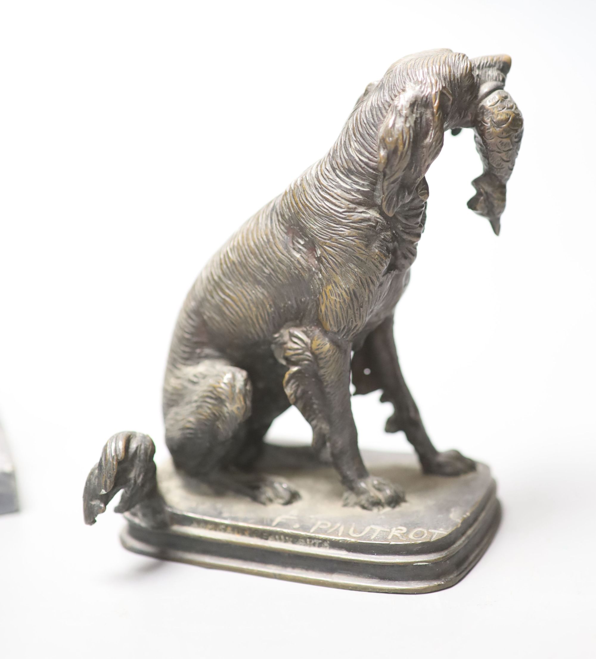 F. Pautrot. A seated bronze hunting dog, 12cm and a spelter figure of a griffin